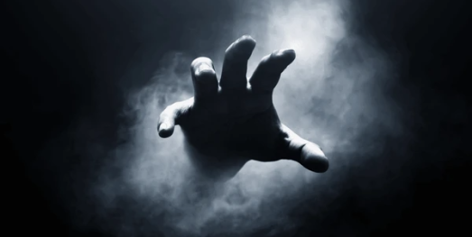 Temple of the Sleeping God Human Hand On Dark Background 600nw 2195622815